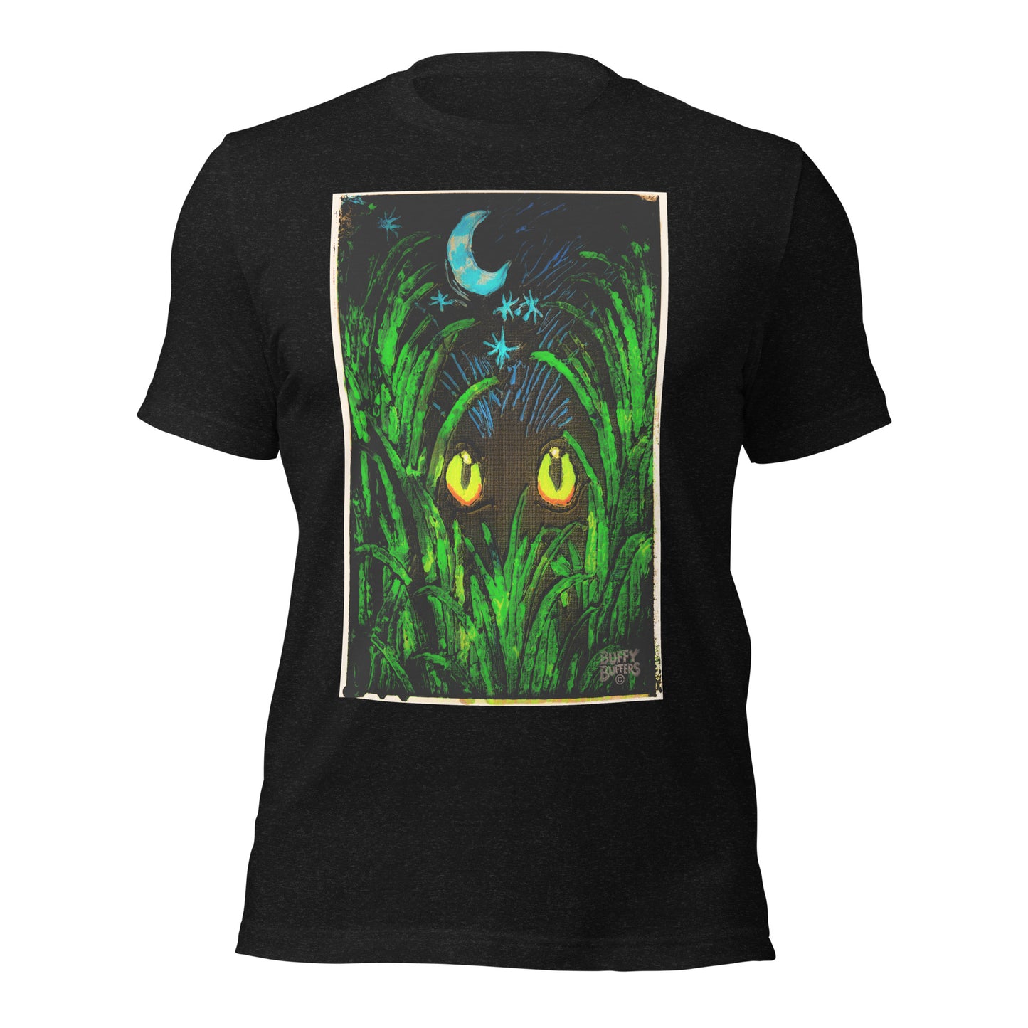 Black heather unisex t-shirt featuring "Midnight Watcher" artwork – glowing yellow eyes in green grass under a crescent moon (Canva Collection)