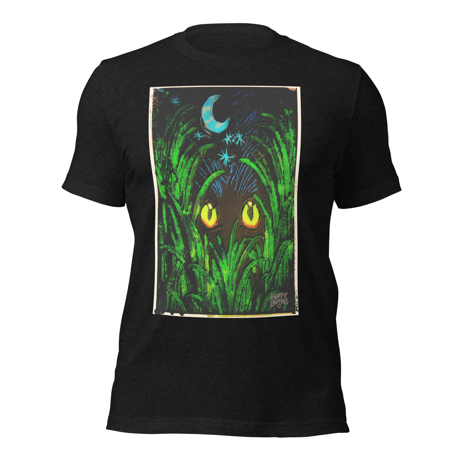 Black heather unisex t-shirt featuring "Midnight Watcher" artwork – glowing yellow eyes in green grass under a crescent moon (Canva Collection)